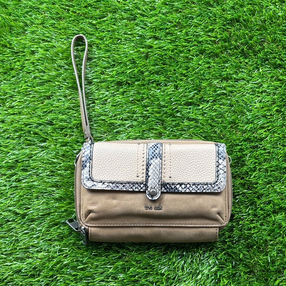 The Sak Tan and Cream Wristlet with Snakeskin Accent